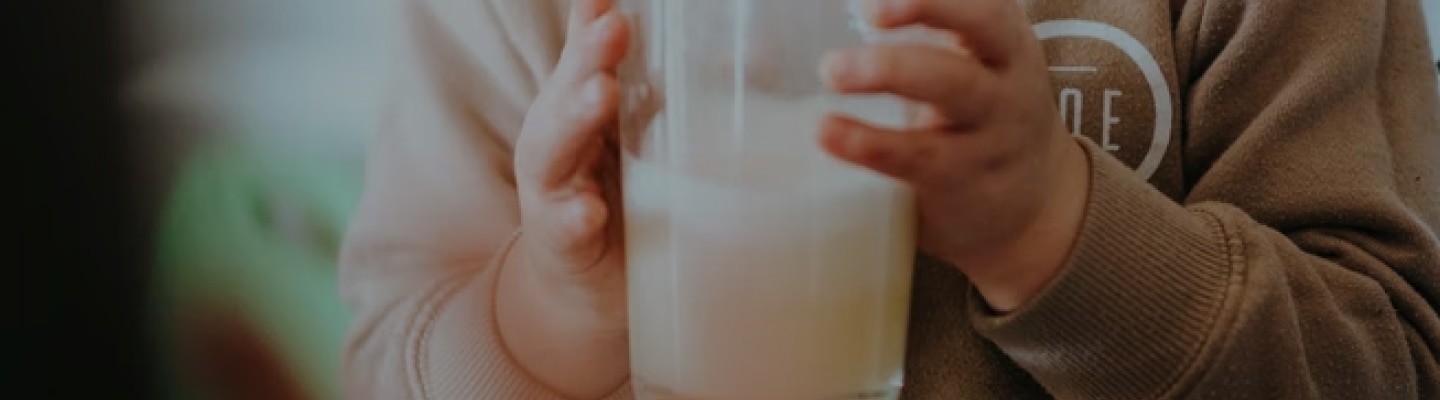 Child drinking a glass of dairy-free formula